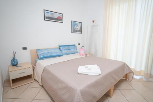 Ένα ή περισσότερα κρεβάτια σε δωμάτιο στο Residence l'Appartamento