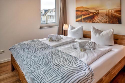 Een bed of bedden in een kamer bij Strandland