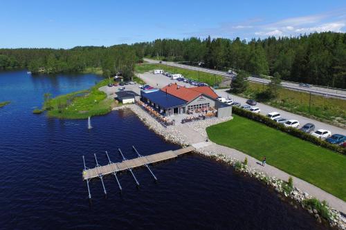 an aerial view of a house on an island in the water at Lakelodge in Karlskoga