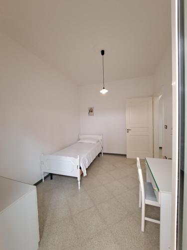 Ένα ή περισσότερα κρεβάτια σε δωμάτιο στο Casa Vittorio a 100m dalla Sabbia