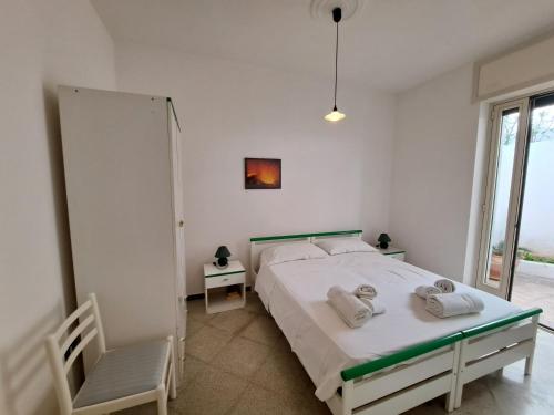 Ένα ή περισσότερα κρεβάτια σε δωμάτιο στο Casa Vittorio a 100m dalla Sabbia