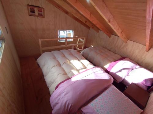 מיטה או מיטות בחדר ב-Hospedaje Flover