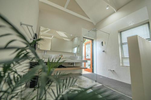 a bathroom with a sink and a mirror at Little Kubu Lodge in Hoedspruit
