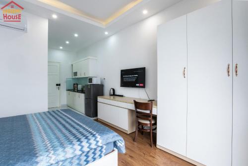 a small kitchen with a bed in a room at Merry House Imperia in Hai Phong