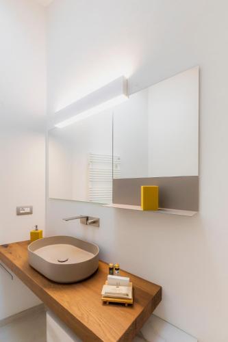a bathroom with a large sink on a wooden counter at Residenza Benizzi rooms in the heart of Florence in Florence