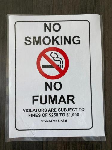 a no smoking sign is posted on a wall at Luxury Adventure CN Tower/MTCC/Scotiabank Arena in Toronto