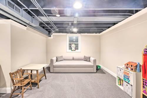 a living room with a couch and a table at Home with Office and Yard 25 Mi to Downtown Chicago! in Glen Ellyn