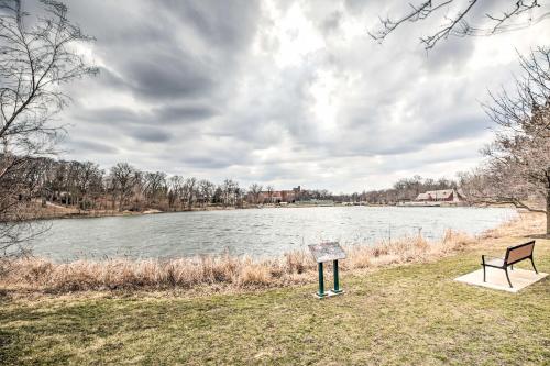 two benches sitting next to a body of water at Home with Office and Yard 25 Mi to Downtown Chicago! in Glen Ellyn