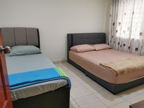 Katil atau katil-katil dalam bilik di Sea Front The Regency - 1 Parking