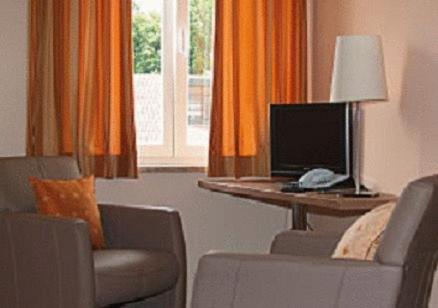 Hotel Donauにあるテレビまたはエンターテインメントセンター