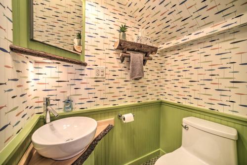 a bathroom with a white toilet and a sink at 1 Block to Downtown Cozy Condo by Mirror Lake in Lake Placid