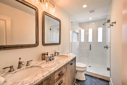 a bathroom with two sinks and a shower at The Ultimate Luxury Retreat on Lake Burton! in Clayton