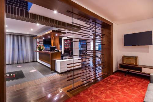 an office lobby with a large glass wall at AZ Hotel in Bogotá