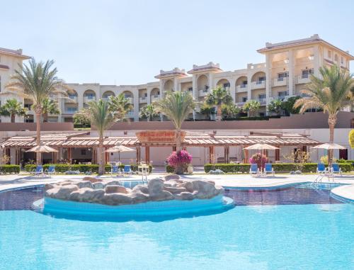 a pool at a resort with a ride in the water at Serenity Alma Heights - Ex Serenity Fun City in Hurghada