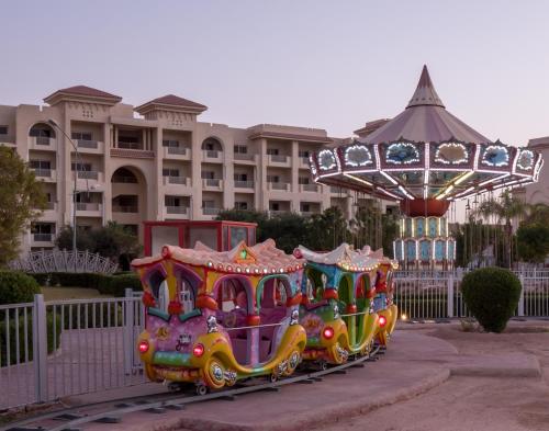 a train ride at a resort with a carousel at Serenity Alma Heights - Ex Serenity Fun City in Hurghada
