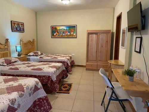 Postel nebo postele na pokoji v ubytování Hotel-Villas JABEL TINAMIT