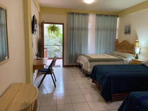 Postel nebo postele na pokoji v ubytování Hotel-Villas JABEL TINAMIT