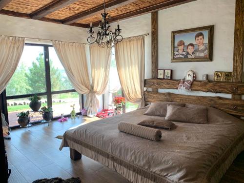 Postel nebo postele na pokoji v ubytování Chervona Kalyna Cottage
