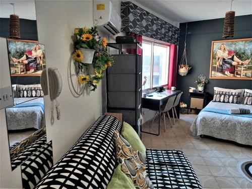 a room with two beds and a couch in it at Artemis Boutique Apartment 2 in Limassol