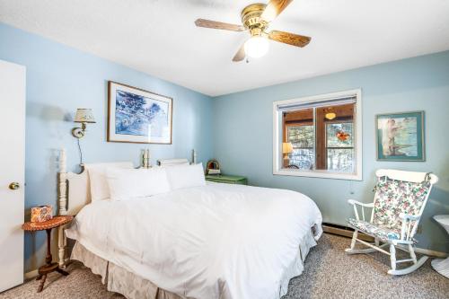 a bedroom with a white bed and a window at Retreat in McCall