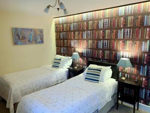 A bed or beds in a room at The Dove Inn 