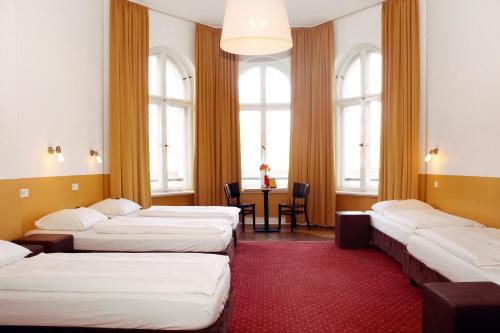 Postel nebo postele na pokoji v ubytování Grand Hostel Berlin Classic