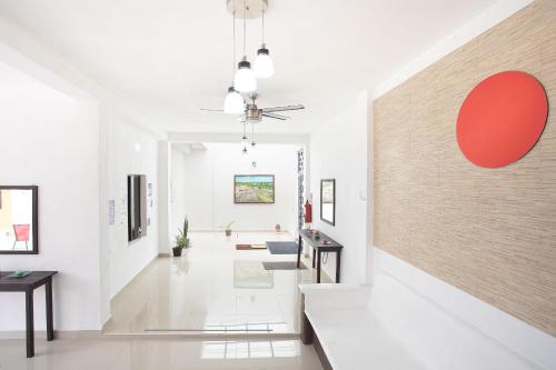 a hallway with white walls and a large wall at Hotel Casa Ariana in Bacalar