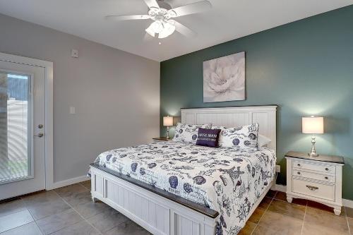 a bedroom with a bed and a ceiling fan at A Piers to Be Tan in Port Aransas