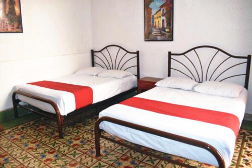 Katil atau katil-katil dalam bilik di Hotel Margarita