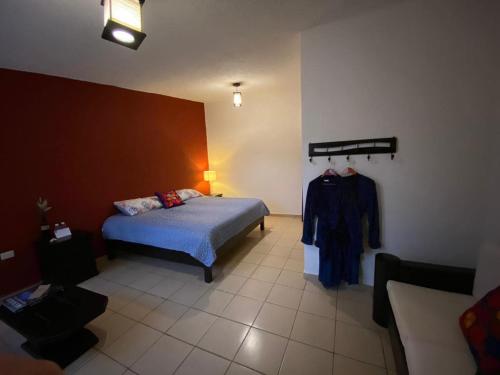 Ένα ή περισσότερα κρεβάτια σε δωμάτιο στο Hotel Boutique Calderon