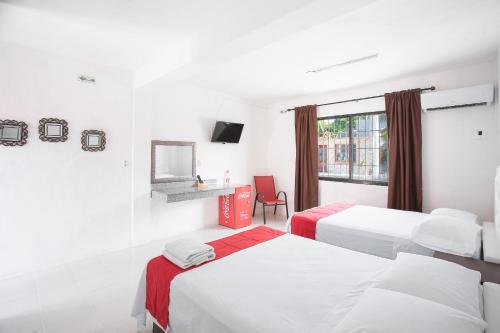 Postel nebo postele na pokoji v ubytování Hotel Casa Ariana