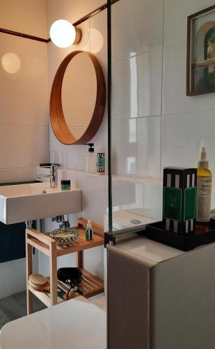 a bathroom with a sink and a mirror at Casa Carmen in Laroles