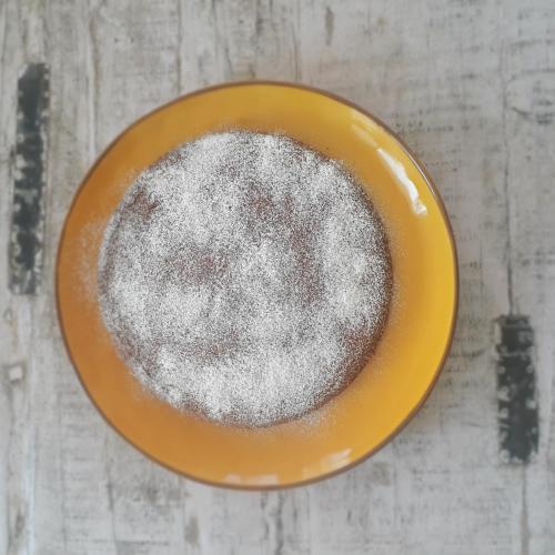 a yellow bowl filled with powdered sugar on a table at CA' DA TOLLO in Cogorno