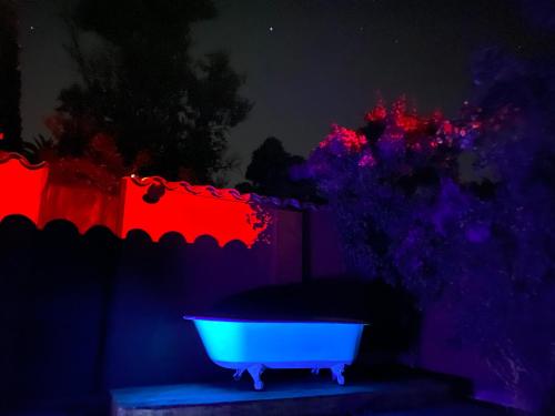 a bath tub in a dark room with lights at Casona Lo Aguirre , Hospedaje de Temporada Cálidas in Talagante