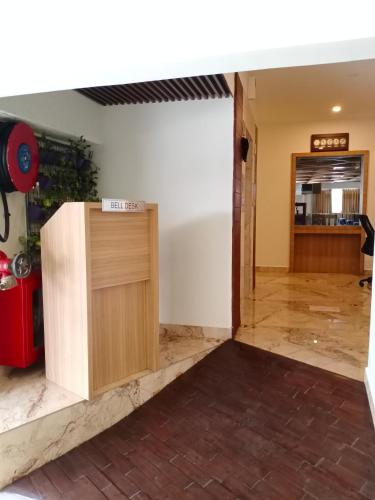 a view of a room with a wooden door at HOTEL GEO in Cochin