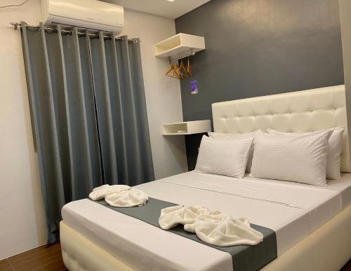 Кровать или кровати в номере Viajeros Hostel Boracay