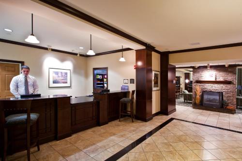 a large kitchen with a large counter top at Staybridge Suites Lansing-Okemos, an IHG Hotel in Okemos