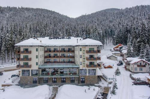 an aerial view of a resort in the snow at Hotel Belmont & Spa in Sinaia