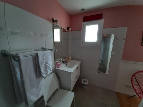 a bathroom with a toilet and a sink at Escales dans les dunes in Créances