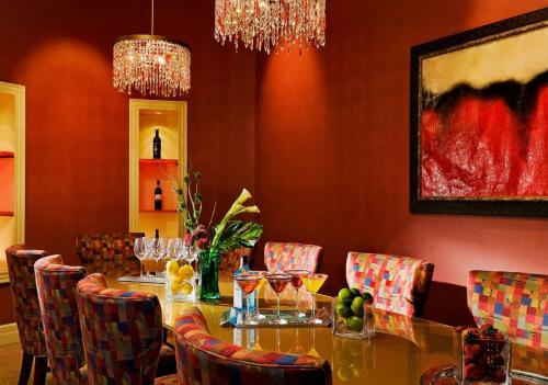 a dining room with a table and chairs with wine glasses at The Exeter Inn in Exeter
