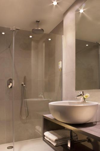 a bathroom with a sink and a shower at Hotel Désirée - Garda Lake Collection in Sirmione