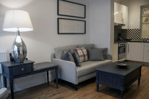 a living room with a couch and a table at Downshire Haven in Holywood