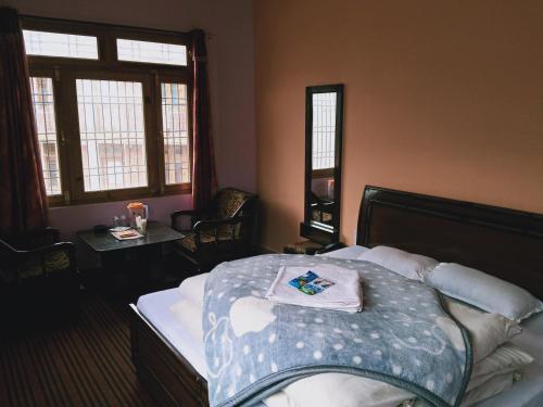 Ένα ή περισσότερα κρεβάτια σε δωμάτιο στο Mahima