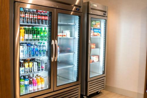 a refrigerator filled with lots of drinks at Holiday Inn Express & Suites - Brandon by IHG in Brandon