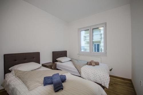Ένα ή περισσότερα κρεβάτια σε δωμάτιο στο Sarajevo Dream Apartment