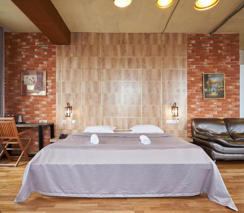 a bedroom with a large bed in a room at 7 days hotel in Almaty