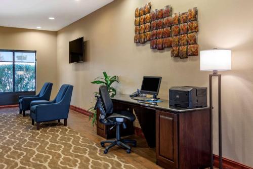 an office with a desk with a computer and chairs at Comfort Suites Airport South in Montgomery