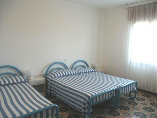 Cama o camas de una habitación en Appartamenti Ariston