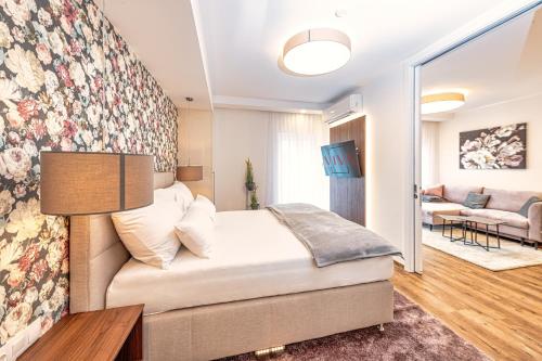 Кровать или кровати в номере VIVA Apartments