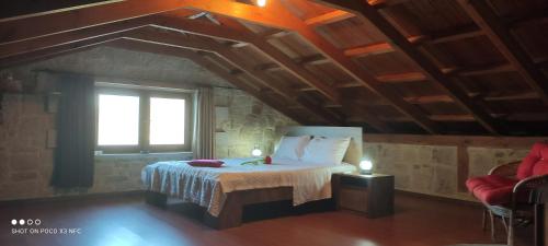 A bed or beds in a room at Vasiliki's Residence - Breathtaking View